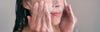 Woman cleansing her skin
