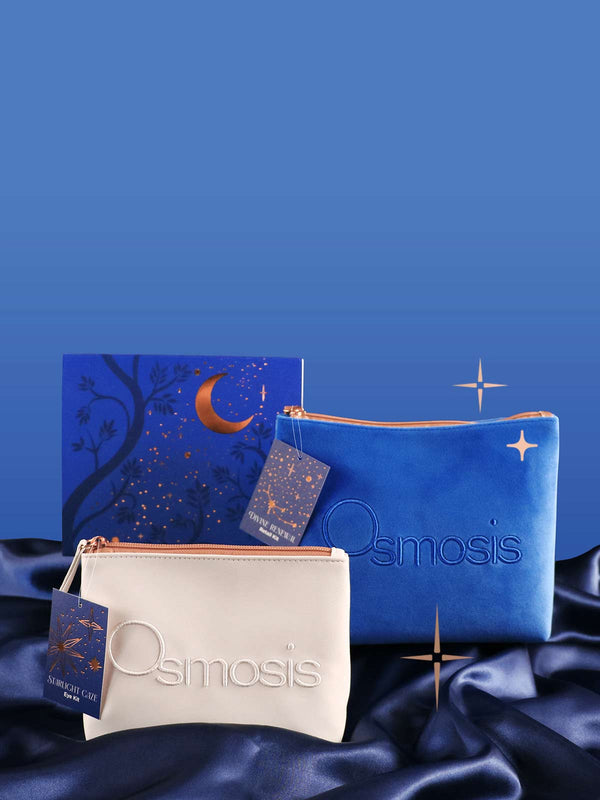 Two Osmosis pouches, one blue and one beige, on a blue satin background.