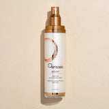 Osmosis Boost Peptide Activating Mist bottle on a beige background