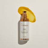 Osmosis Calm serum bottle with a yellow smear on a light beige background