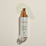 Osmosis Cleanse bottle with pump on a beige background