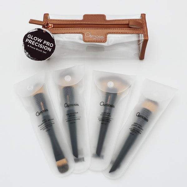 Set of makeup brushes with a clear pouch and 'Osmosis Beauty' branding on a white background.