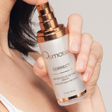 Osmosis Correct preventative retinal serum held by a person against a neutral background