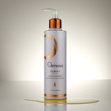 Osmosis Purify Enzyme Cleanser bottle on a reflective surface with a neutral background