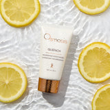 Osmosis Quench moisturizer with lemon slices on a white background