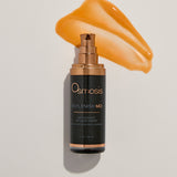 Osmosis Replenish MD serum bottle with a swatch of serum on a beige background